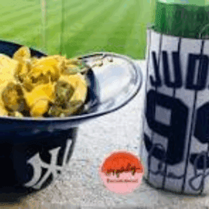 Nachos and drink at a baseball game.