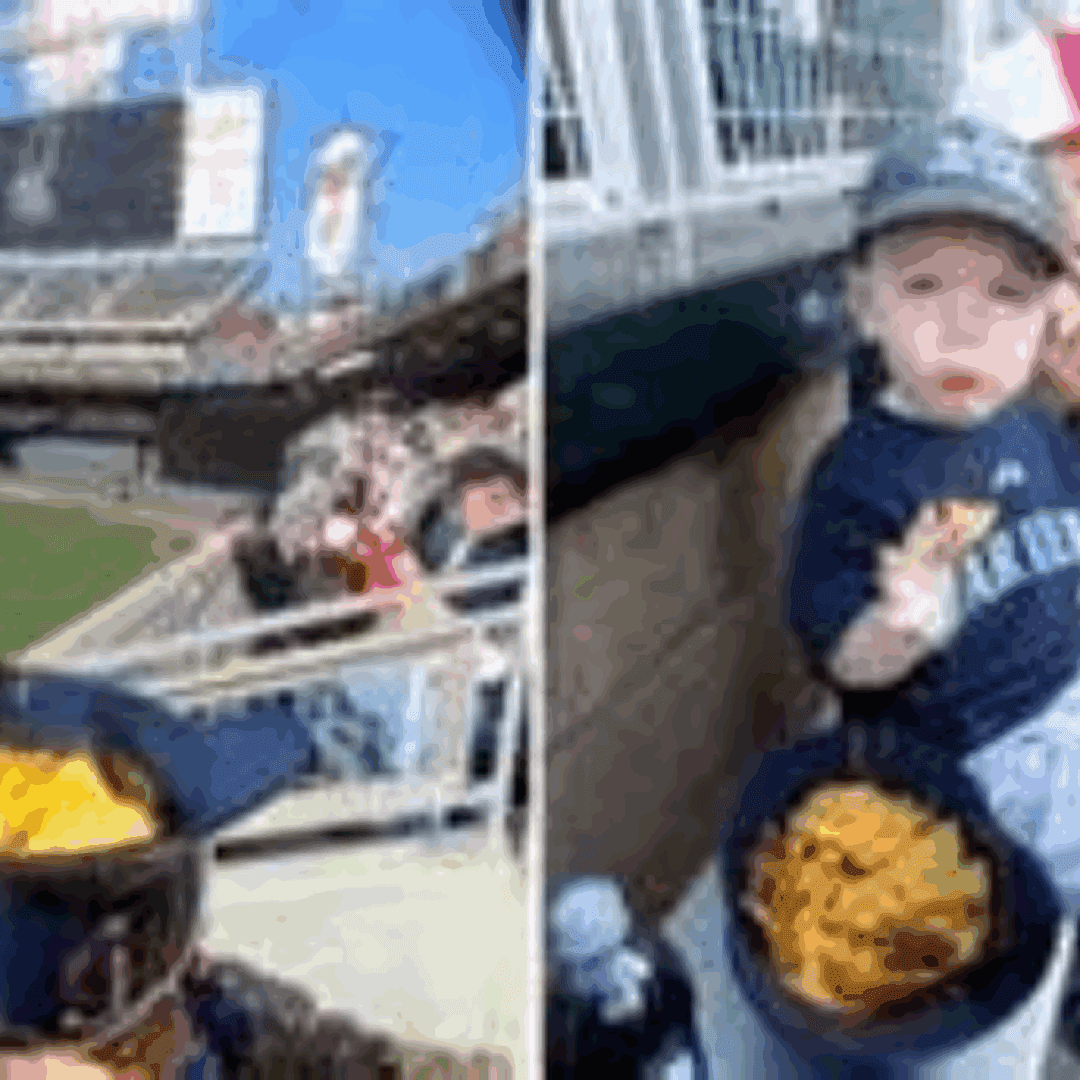 Child at baseball game with glove and cap.