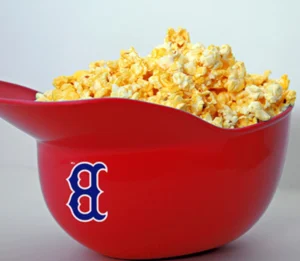 Red bowl of popcorn with blue logo.